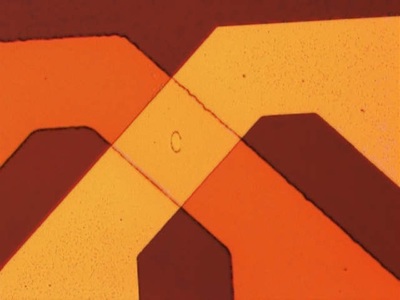 A dark orange background and a medium orange area coming down to cross over a lighter orange area.